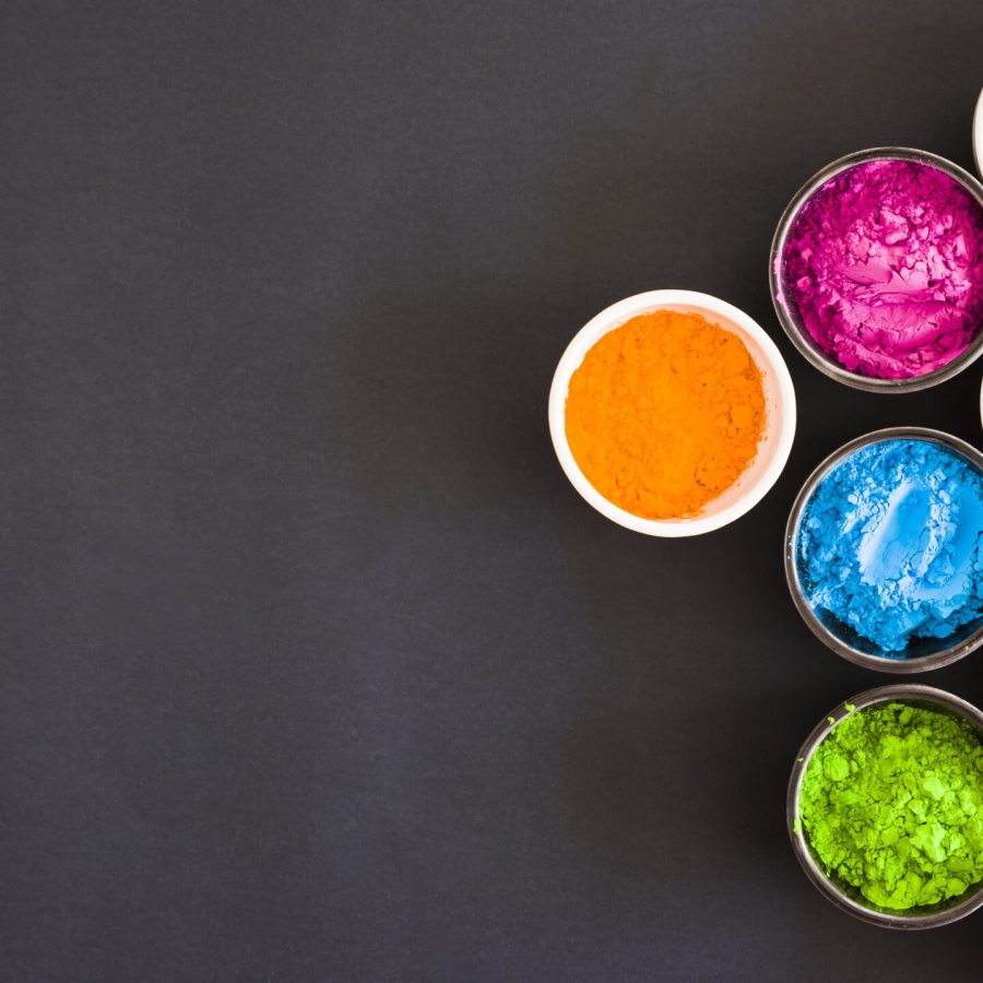 overhead-view-bowls-with-color-holi-powder-black-backdrop